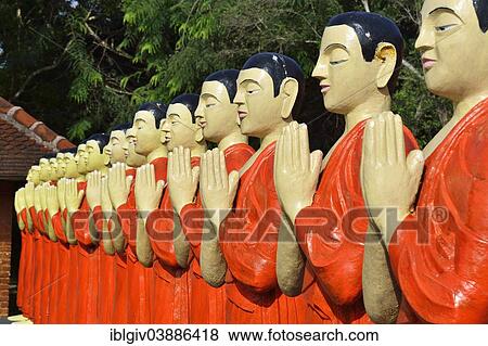 "Figures of Buddhist monks in front of a monastery, near Sigiriya, Central Province, Sri Lanka, Asia" View Large Photo Image Stock Photo - "Figures of Buddhist monks in front of a monastery, near Sigiriya, Central Province, Sri Lanka, Asia". Fotosearch