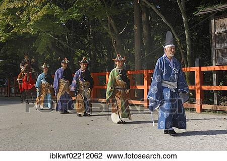 Stock Image - "Final procession of Shinto helpers at the riders competitions at the traditional Kamigamo Shrine, UNESCO World Heritage Site, Kyoto, Japan, East Asia, Asia". Fotosearch