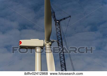 Final stages of assembling a rotor to the generator nacelle of a wind turbine, Grevenbroich, North Rhine-Westphalia, Germany, Europe View Large Photo Image Stock Photo - Final stages of assembling a rotor to the generator nacelle of a wind turbine, Grevenbroich, North Rhine-Westphalia, Germany, Europe. Fotosearch