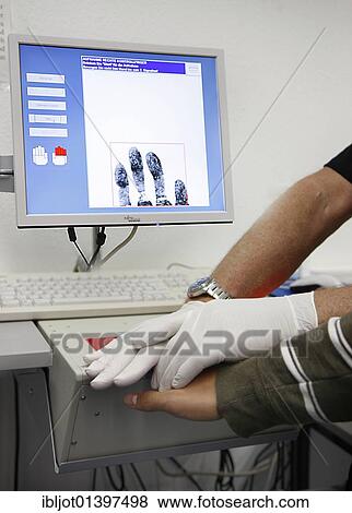 "Fingerprints and handprints being recorded by digital scanner, physical identification of a suspect in a criminal investigation by the Criminal Investigation Department, re-enacted scene" View Large Photo Image Stock Photo - "Fingerprints and handprints being recorded by digital scanner, physical identification of a suspect in a criminal investigation by the Criminal Investigation Department, re-enacted scene". Fotosearch