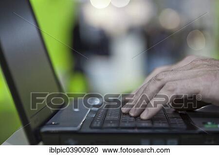 Fingers typing on a laptop View Large Photo Image Stock Image - Fingers typing on a laptop. Fotosearch