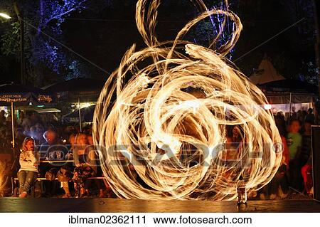 Stock Image - "Fire show during the night market festival, Herrsching am Ammersee, Fuenfseenland region, Upper Bavaria, Bavaria, Germany, Europe". Fotosearch