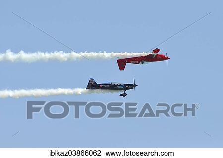 "Firebird Aerobatics Team, Aircraft flies upside down over another aircraft, Milwaukee Air Show, Milwaukee, Wisconsin, USA" View Large Photo Image Stock Image - "Firebird Aerobatics Team, Aircraft flies upside down over another aircraft, Milwaukee Air Show, Milwaukee, Wisconsin, USA". Fotosearch