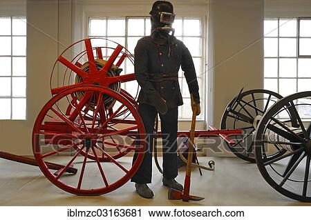 "Firefighter wearing a breathing protection mask in front of a hose reel, early 20th century, exhibition of 150 years of Lauf Fire Department, Lauf Industrial Museum, Lauf an der Pegnitz, Middle Franconia, Bavaria, Germany, Europe" View Large Photo Image Stock Image - "Firefighter wearing a breathing protection mask in front of a hose reel, early 20th century, exhibition of 150 years of Lauf Fire Department, Lauf Industrial Museum, Lauf an der Pegnitz, Middle Franconia, Bavaria, Germany, Europe". Fotosearch