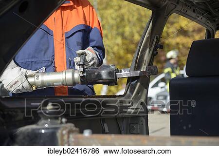 Firefighter working with hydraulic rescue equipment, final fire service drill of the young Stuttgart firefighters in autumn, Stuttgart, Baden-Wuerttemberg, Germany, Europe View Large Photo Image Stock Photograph - Firefighter working with hydraulic rescue equipment, final fire service drill of the young Stuttgart firefighters in autumn, Stuttgart, Baden-Wuerttemberg, Germany, Europe. Fotosearch