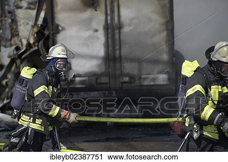 "Firefighters extinguishing a truck fire on the A8 motorway near the """"Echterdinger Ei"""" junction, Stuttgart, Baden-Wuerttemberg, Germany, Europe" View Large Photo Image Stock Image - "Firefighters extinguishing a truck fire on the A8 motorway near the """"Echterdinger Ei"""" junction, Stuttgart, Baden-Wuerttemberg, Germany, Europe". Fotosearch