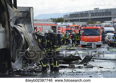 "Firefighters extinguishing a truck fire on the A8 motorway near the """"Echterdinger Ei"""" junction, Stuttgart, Baden-Wuerttemberg, Germany, Europe" View Large Photo Image Stock Photograph - "Firefighters extinguishing a truck fire on the A8 motorway near the """"Echterdinger Ei"""" junction, Stuttgart, Baden-Wuerttemberg, Germany, Europe". Fotosearch