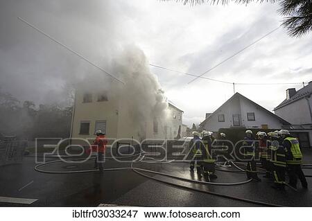 "Firefighters fighting a house fire, Weitersburg, Rhineland-Palatinate, Germany, Europe" View Large Photo Image Stock Photo - "Firefighters fighting a house fire, Weitersburg, Rhineland-Palatinate, Germany, Europe". Fotosearch