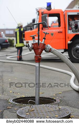 "Firefighters in operation, standpipe in an underground hydrant, Aichwald, Baden-Wuerttemberg, Germany, Europe" View Large Photo Image Stock Photo - "Firefighters in operation, standpipe in an underground hydrant, Aichwald, Baden-Wuerttemberg, Germany, Europe". Fotosearch