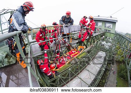 "Firefighters practicing rescue from heights on the old Henrichenburg boat lift, Waltrop, North Rhine-Westphalia, Germany, Europe" View Large Photo Image Stock Image - "Firefighters practicing rescue from heights on the old Henrichenburg boat lift, Waltrop, North Rhine-Westphalia, Germany, Europe". Fotosearch