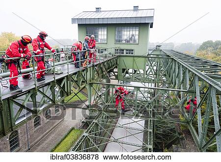 "Firefighters practicing rescue from heights on the old Henrichenburg boat lift, Waltrop, North Rhine-Westphalia, Germany, Europe" View Large Photo Image Stock Photo - "Firefighters practicing rescue from heights on the old Henrichenburg boat lift, Waltrop, North Rhine-Westphalia, Germany, Europe". Fotosearch
