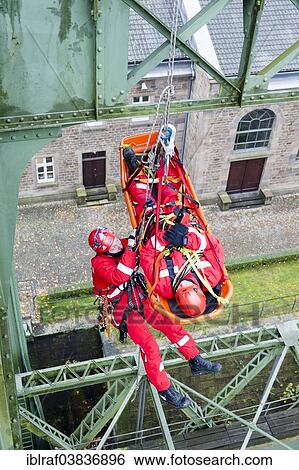 "Firefighters practicing rescue from heights on the old Henrichenburg boat lift, Waltrop, North Rhine-Westphalia, Germany, Europe" View Large Photo Image Stock Photograph - "Firefighters practicing rescue from heights on the old Henrichenburg boat lift, Waltrop, North Rhine-Westphalia, Germany, Europe". Fotosearch