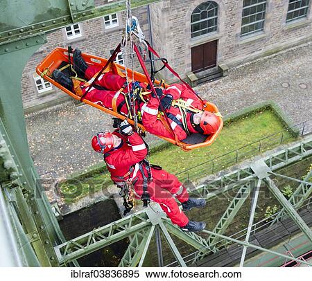 "Firefighters practicing rescue from heights on the old Henrichenburg boat lift, Waltrop, North Rhine-Westphalia, Germany, Europe" View Large Photo Image Stock Photography - "Firefighters practicing rescue from heights on the old Henrichenburg boat lift, Waltrop, North Rhine-Westphalia, Germany, Europe". Fotosearch