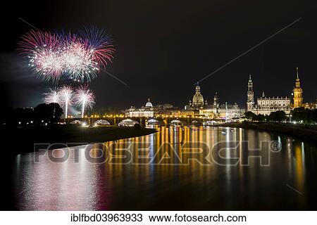 Stock Image - "Fireworks illuminating the historic part of the town with Frauenkirche church and Bruhl's Terrace, seen from the Marienbrucke bridge, Dresden, Saxonia, Germany, Europe". Fotosearch