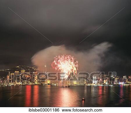 Stock Photograph - "Fireworks over the skyline of Victoria Island, view from Kowloon, night scene, Central District, Hong Kong, Hong Kong Island, Hong kong, China, People's Republic of China, Asia". Fotosearch