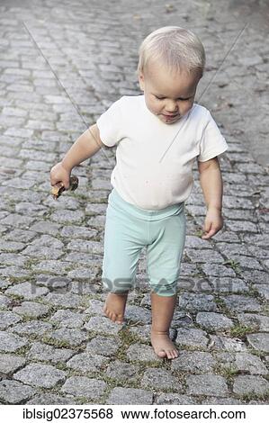 Stock Photo - First steps of a toddler. Fotosearch