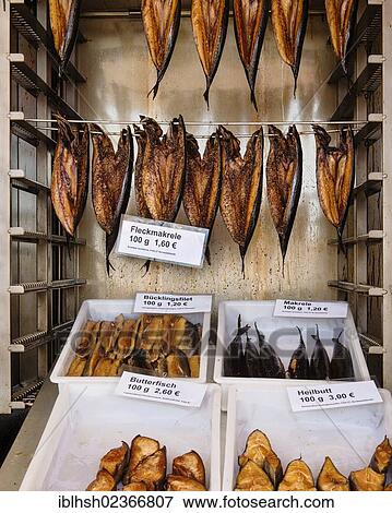 Stock Photo - "Fish for sale, spotted mackerel, smoked herring, butterfish, halibut". Fotosearch