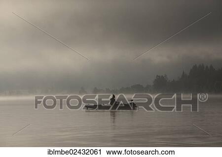 "Fisherman early in the morning with fog in the morning light on Weissensee lake, Carinthia, Austria, Europe" View Large Photo Image Stock Image - "Fisherman early in the morning with fog in the morning light on Weissensee lake, Carinthia, Austria, Europe". Fotosearch