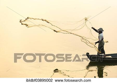 "Fisherman in a boat tossing out a net, morning light, Thaungthaman Lake, Amarapura, Mandalay Division, Myanmar, Asia" View Large Photo Image Stock Image - "Fisherman in a boat tossing out a net, morning light, Thaungthaman Lake, Amarapura, Mandalay Division, Myanmar, Asia". Fotosearch