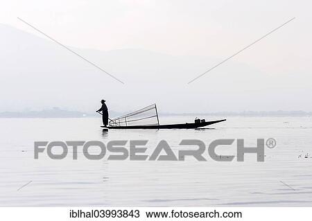"Fisherman, leg rower, on a boat on Inle Lake, Shan State, Myanmar, Asia" View Large Photo Image Stock Image - "Fisherman, leg rower, on a boat on Inle Lake, Shan State, Myanmar, Asia". Fotosearch