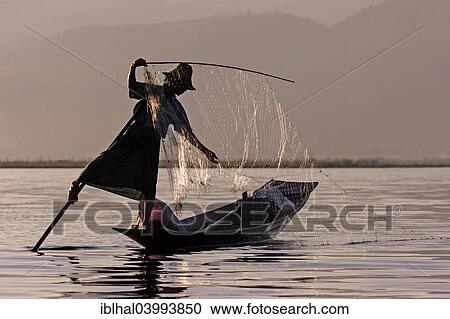 "Fisherman, leg rower, on a boat on Inle Lake, Shan State, Myanmar, Asia" View Large Photo Image Stock Image - "Fisherman, leg rower, on a boat on Inle Lake, Shan State, Myanmar, Asia". Fotosearch