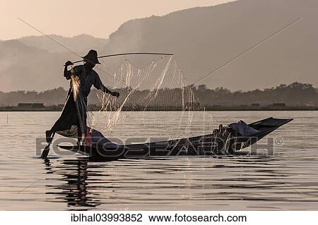 "Fisherman, leg rower, on a boat on Inle Lake, Shan State, Myanmar, Asia" View Large Photo Image Stock Image - "Fisherman, leg rower, on a boat on Inle Lake, Shan State, Myanmar, Asia". Fotosearch