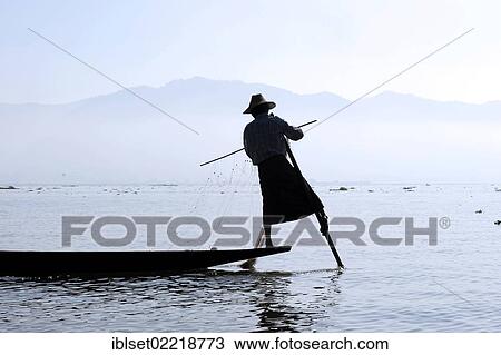 "Fisherman, leg rower on Lake Inle, Burma also known as Myanmar, Southeast Asia, Asia" View Large Photo Image Stock Image - "Fisherman, leg rower on Lake Inle, Burma also known as Myanmar, Southeast Asia, Asia". Fotosearch