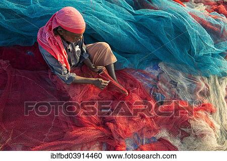 "Fisherman repairing fishing nets, Varkala, Kerala, India, Asia" View Large Photo Image Stock Image - "Fisherman repairing fishing nets, Varkala, Kerala, India, Asia". Fotosearch