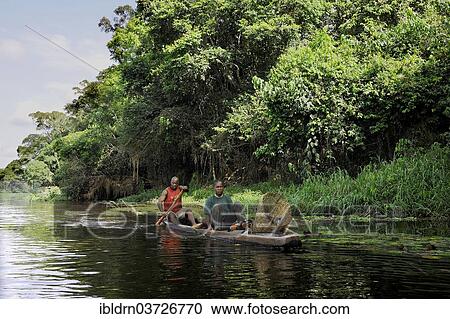 "Fisherman travelling with his wife along the Nyong River to set fish traps, Centre Region, Cameroon, Africa" View Large Photo Image Stock Image - "Fisherman travelling with his wife along the Nyong River to set fish traps, Centre Region, Cameroon, Africa". Fotosearch
