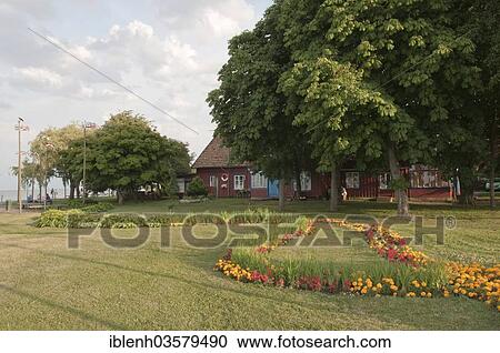 Stock Image - "Fisherman's cottage and garden, Nida, Curonian Spit, KlaipÄ—da County, Lithuania, Europe". Fotosearch