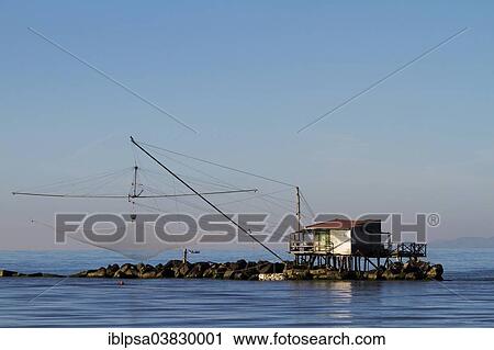 "Fisherman's house with a net over the sea in Marina di Pisa, Tuscany, Italy, Europe" View Large Photo Image Stock Image - "Fisherman's house with a net over the sea in Marina di Pisa, Tuscany, Italy, Europe". Fotosearch