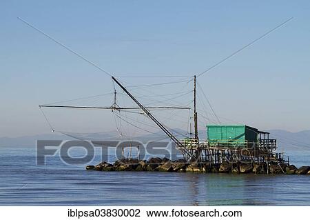 "Fisherman's house with a net over the sea in Marina di Pisa, Tuscany, Italy, Europe" View Large Photo Image Stock Image - "Fisherman's house with a net over the sea in Marina di Pisa, Tuscany, Italy, Europe". Fotosearch