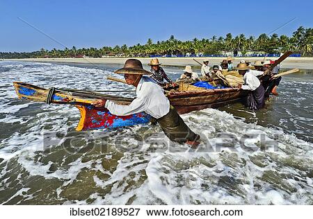 "Fishermen entering the sea at the palm beach of Ngwe Saung Beach, Myanmar, Burma, Southeast Asia, Asia" View Large Photo Image Stock Photo - "Fishermen entering the sea at the palm beach of Ngwe Saung Beach, Myanmar, Burma, Southeast Asia, Asia". Fotosearch