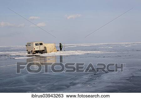 "Fishermen fishing on the frozen Lake Baikal, Bolschoje Goloustnoje, Lake Baikal Region, Siberia, Russia, Europe" View Large Photo Image Stock Image - "Fishermen fishing on the frozen Lake Baikal, Bolschoje Goloustnoje, Lake Baikal Region, Siberia, Russia, Europe". Fotosearch