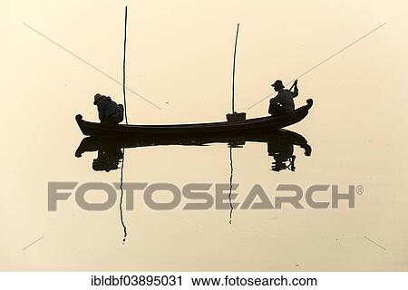 "Fishermen in their boat in the morning light, Thaungthaman Lake, Amarapura, Mandalay Division, Myanmar, Asia" View Large Photo Image Stock Image - "Fishermen in their boat in the morning light, Thaungthaman Lake, Amarapura, Mandalay Division, Myanmar, Asia". Fotosearch