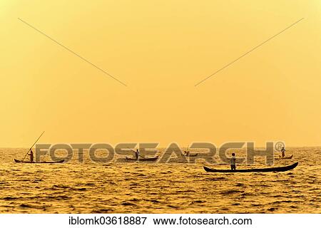 "Fishermen in their boats at sunrise, Vembanad lake, Kerala, India, Asia" View Large Photo Image Stock Photo - "Fishermen in their boats at sunrise, Vembanad lake, Kerala, India, Asia". Fotosearch