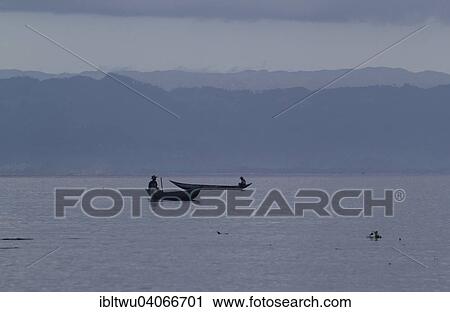 "Fishermen in their boats, sunrise in front of the rainforest of Masoala, Northeastern Madagascar, Madagascar, Africa" View Large Photo Image Stock Image - "Fishermen in their boats, sunrise in front of the rainforest of Masoala, Northeastern Madagascar, Madagascar, Africa". Fotosearch