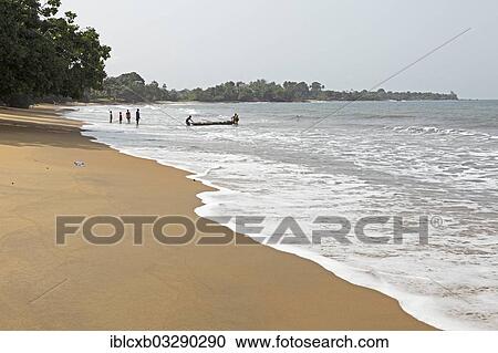 "Fishermen with a boat on the beach, Kribi, South Region, Cameroon, Africa" View Large Photo Image Stock Image - "Fishermen with a boat on the beach, Kribi, South Region, Cameroon, Africa". Fotosearch