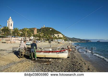 "Fishermen with a fishing boat on the beach of Noli, Riviera di Ponente, Liguria, Italy, Europe" View Large Photo Image Stock Image - "Fishermen with a fishing boat on the beach of Noli, Riviera di Ponente, Liguria, Italy, Europe". Fotosearch