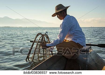 "Fishermen with a traditional basket, canoe, Inle Lake, Shan State, Myanmar, Asia" View Large Photo Image Stock Photo - "Fishermen with a traditional basket, canoe, Inle Lake, Shan State, Myanmar, Asia". Fotosearch