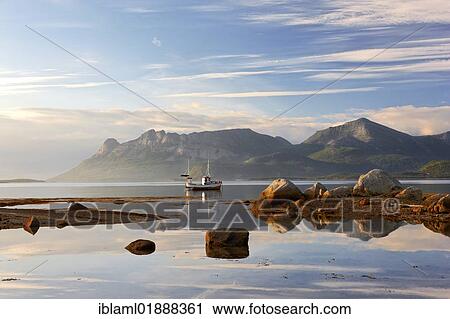 "Fishing boat and view on the Lofoten, Ulvsvag, Hamaroy, Nordland, Norway, Europe" View Large Photo Image Stock Image - "Fishing boat and view on the Lofoten, Ulvsvag, Hamaroy, Nordland, Norway, Europe". Fotosearch