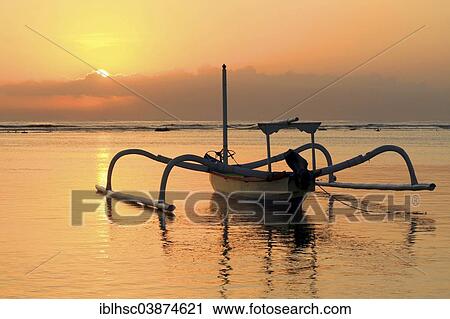 Stock Image - "Fishing boat, beach, sunrise, Sanur, Bali, Indonesia, Asia". Fotosearch