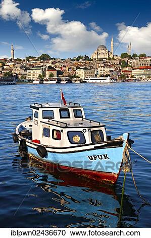 "Fishing boat in the Golden Horn on the Galata banks looking towards the Suleymaniye Mosque, Suleymaniye Camii, on the Third Hill, Istanbul, Turkey, Asia" View Large Photo Image Stock Image - "Fishing boat in the Golden Horn on the Galata banks looking towards the Suleymaniye Mosque, Suleymaniye Camii, on the Third Hill, Istanbul, Turkey, Asia". Fotosearch