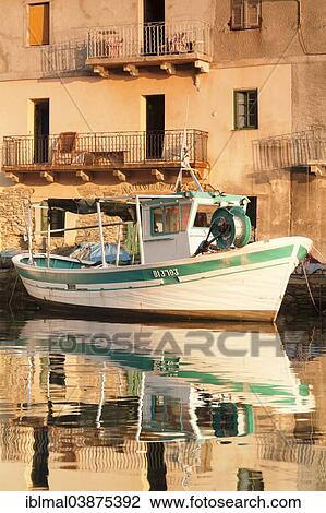 "Fishing boat in the harbor of Port de Centuri, Corsica, France, Europe" View Large Photo Image Stock Image - "Fishing boat in the harbor of Port de Centuri, Corsica, France, Europe". Fotosearch