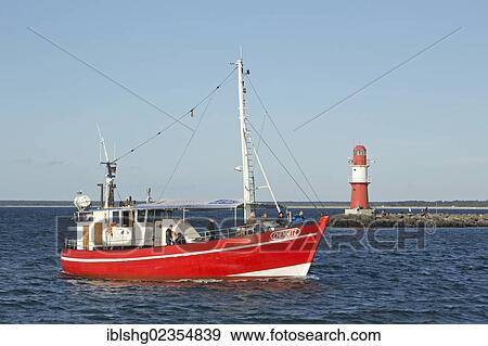 Stock Photo - "Fishing boat in the Warnow river estuary, Warnemuende, Mecklenburg-Western Pomerania, Germany, Europe". Fotosearch