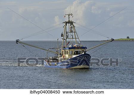 Stock Image - "Fishing boat off Pellworm island, North Frisia, Schleswig-Holstein, Germany, Europe". Fotosearch