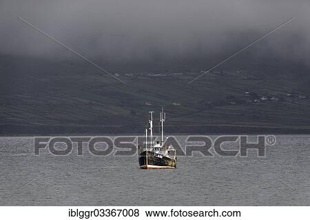 "Fishing boat off the coast, Ballinskelligs, Ring of Kerry, Waterville, County Kerry, Ireland, Europe" View Large Photo Image Stock Photo - "Fishing boat off the coast, Ballinskelligs, Ring of Kerry, Waterville, County Kerry, Ireland, Europe". Fotosearch