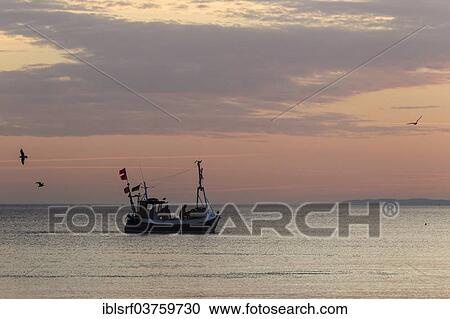 "Fishing boat on the Baltic coast, Bay of Lubeck, Schleswig-Holstein, Germany, Europe" View Large Photo Image Stock Image - "Fishing boat on the Baltic coast, Bay of Lubeck, Schleswig-Holstein, Germany, Europe". Fotosearch