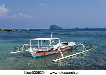 Stock Image - "Fishing boat on the beach of Candi Dasa, Candi Dasa, Bali, Indonesia, Asia". Fotosearch