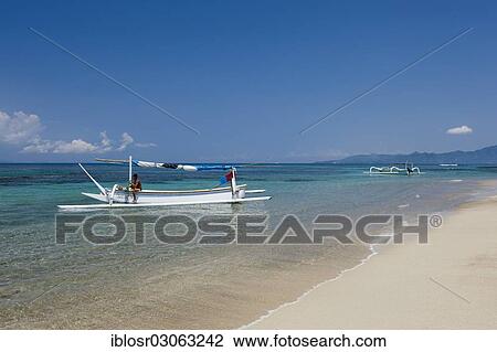 "Fishing boat on the beach of Candi Dasa, Candi Dasa, Bali, Indonesia, Asia" View Large Photo Image Stock Image - "Fishing boat on the beach of Candi Dasa, Candi Dasa, Bali, Indonesia, Asia". Fotosearch